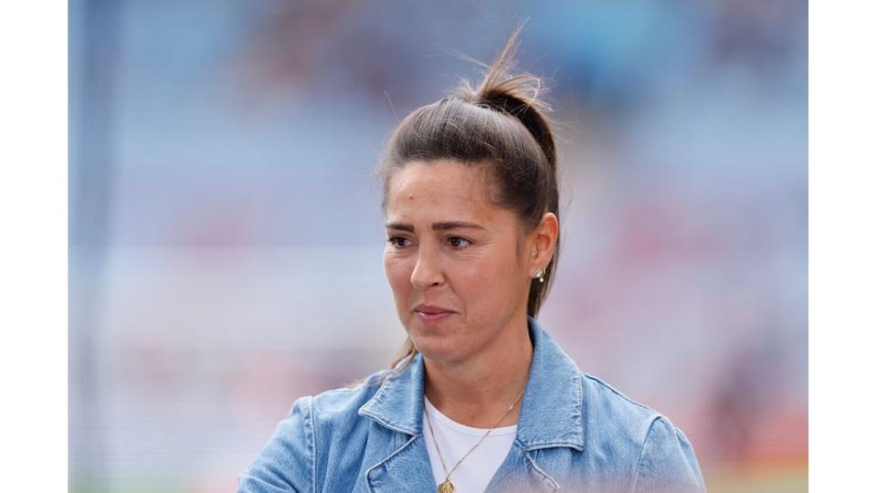 Fara Williams looking serious in a blue denim jacket