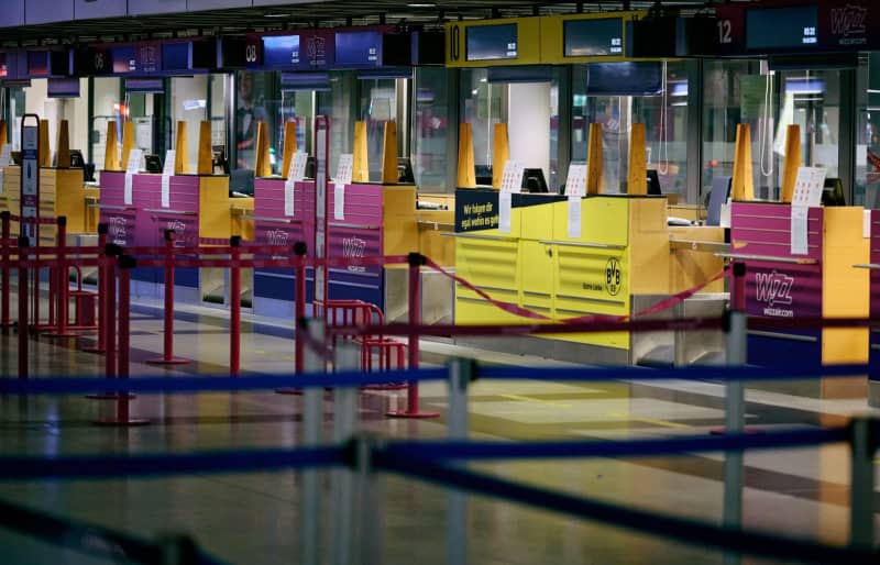 The check-in counters in the departure hall in Dortmund's airport are seen closed during a strike by security staff. The trade union Verdi has called for further warning strikes by aviation security staff at several German airports. Bernd Thissen/dpa