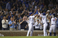 Chicago Cubs' Willson Contreras left, celebrates with Christopher Morel, after Contreras hit a two-run home run against the Cincinnati Reds during the fifth inning of a baseball game Wednesday, June 29, 2022, in Chicago. (AP Photo/Paul Beaty)