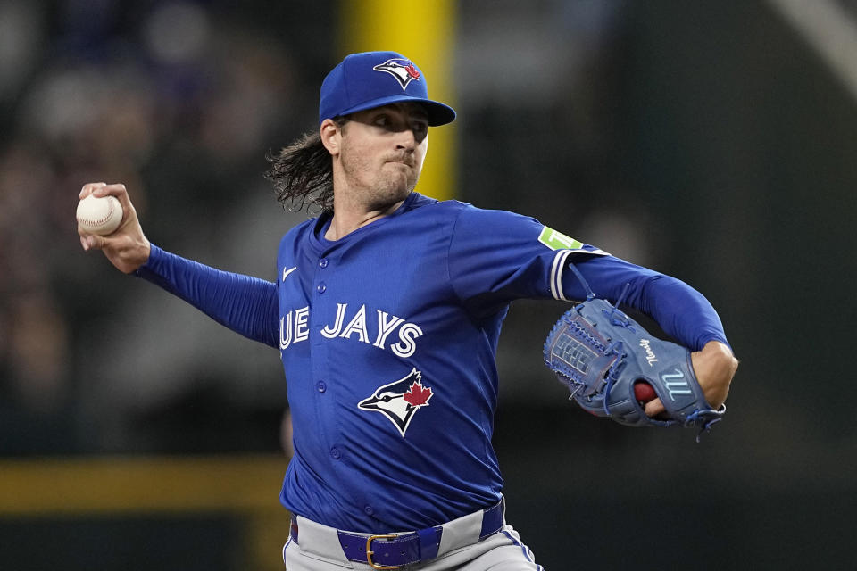 Toronto Blue Jays starting pitcher Kevin Gausman throws to the Texas Rangers in the first inning of a baseball game in Arlington, Texas, Thursday, Sept. 19, 2024. (AP Photo/Tony Gutierrez)