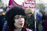 <p>A demonstrator marches during the Denver’s Women’s March in Denver, Colo., on Jan. 20, 2018, one year after thousands of supporters marched around the world in defense of women’s and human rights. (Photo: Jason Connolly/AFP/Getty Images) </p>