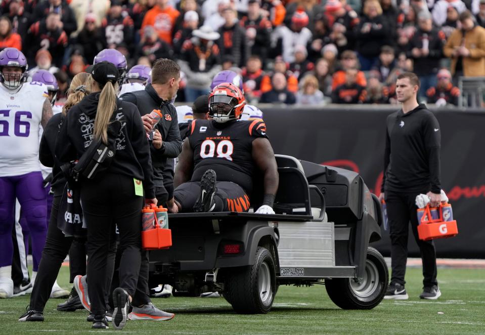 Cincinnati Bengals defensive tackle DJ Reader (98) is taken off the field after an injury to his right knee during the first quarter against the Minnesota Vikings at Paycor Stadium on Saturday, December 16, 2023.