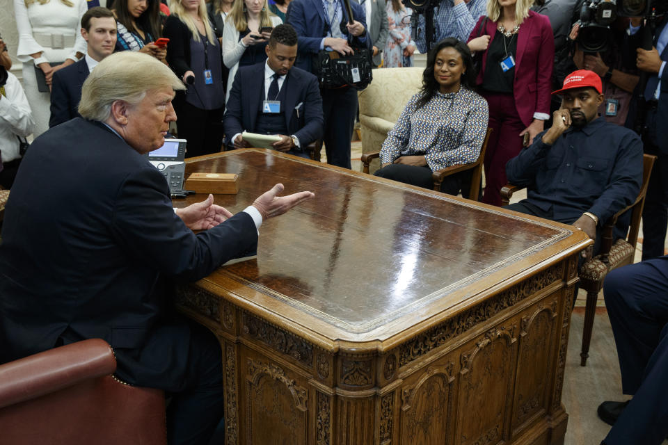 President Donald Trump meets with rapper Kanye West in the Oval Office of the White House, Thursday, Oct. 11, 2018, in Washington. At left is White House Senior Adviser Jared Kushner. (AP Photo/Evan Vucci)