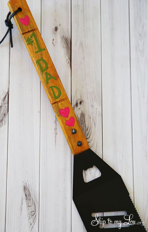 <p>For an easy DIY gift from the kids, let them decorate a spatula for their grill-loving dad with a sweet message.</p><p><strong>Get the tutorial at <a href="https://www.skiptomylou.org/personalized-spatula/" rel="nofollow noopener" target="_blank" data-ylk="slk:Skip to My Lou;elm:context_link;itc:0;sec:content-canvas" class="link ">Skip to My Lou</a>.</strong></p><p><strong><a class="link " href="https://www.amazon.com/RSVP-BBQ-Grill-Spatula-BQ-TRN/dp/B004TGVIAC/?tag=syn-yahoo-20&ascsubtag=%5Bartid%7C10050.g.1171%5Bsrc%7Cyahoo-us" rel="nofollow noopener" target="_blank" data-ylk="slk:Shop Now;elm:context_link;itc:0;sec:content-canvas">Shop Now</a><br></strong></p>