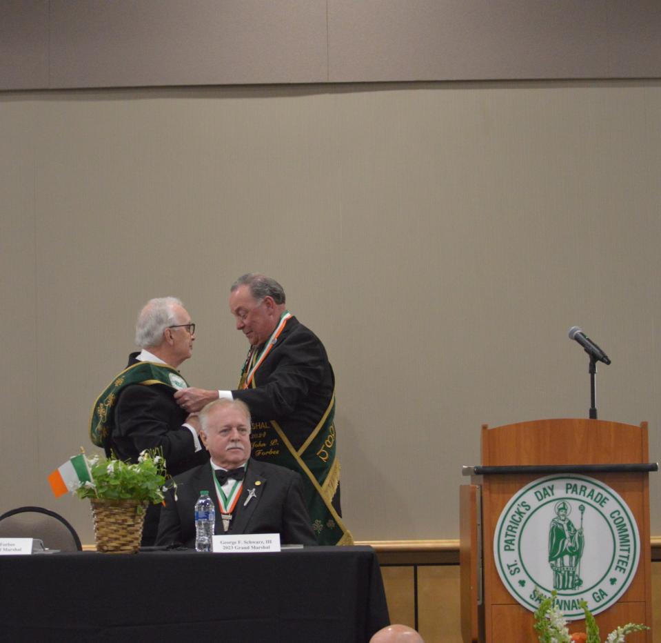 John Forbes gave his father Jim Forbes his aides' sash, 26 years after he was an aide for his father in 1998.