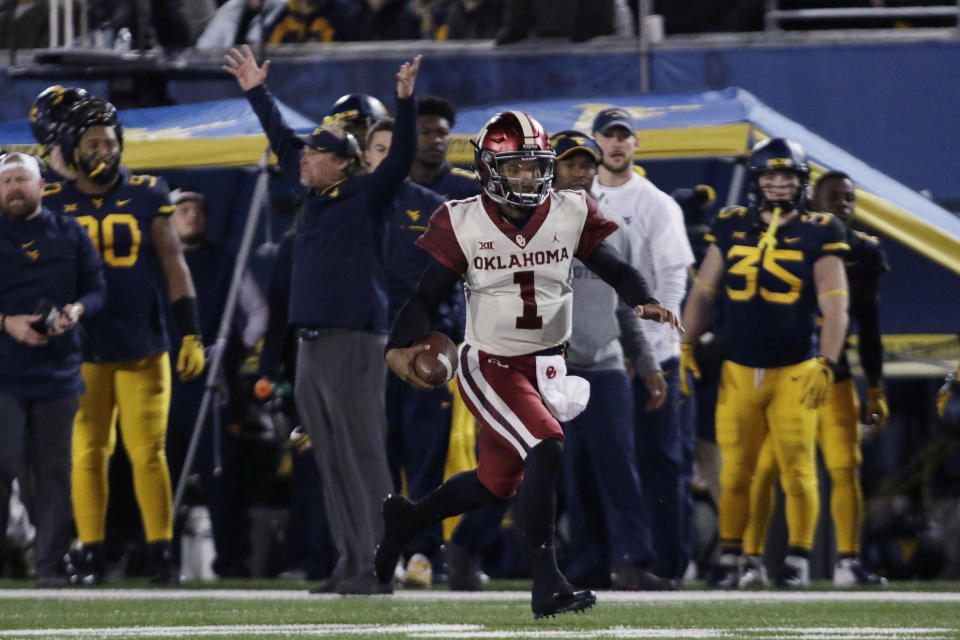 Oklahoma quarterback Kyler Murray (1) runs the ball for a touchdown during the first half of an NCAA college football game against West Virginia on Friday, Nov. 23, 2018, in Morgantown, W.Va. (AP Photo/Raymond Thompson)