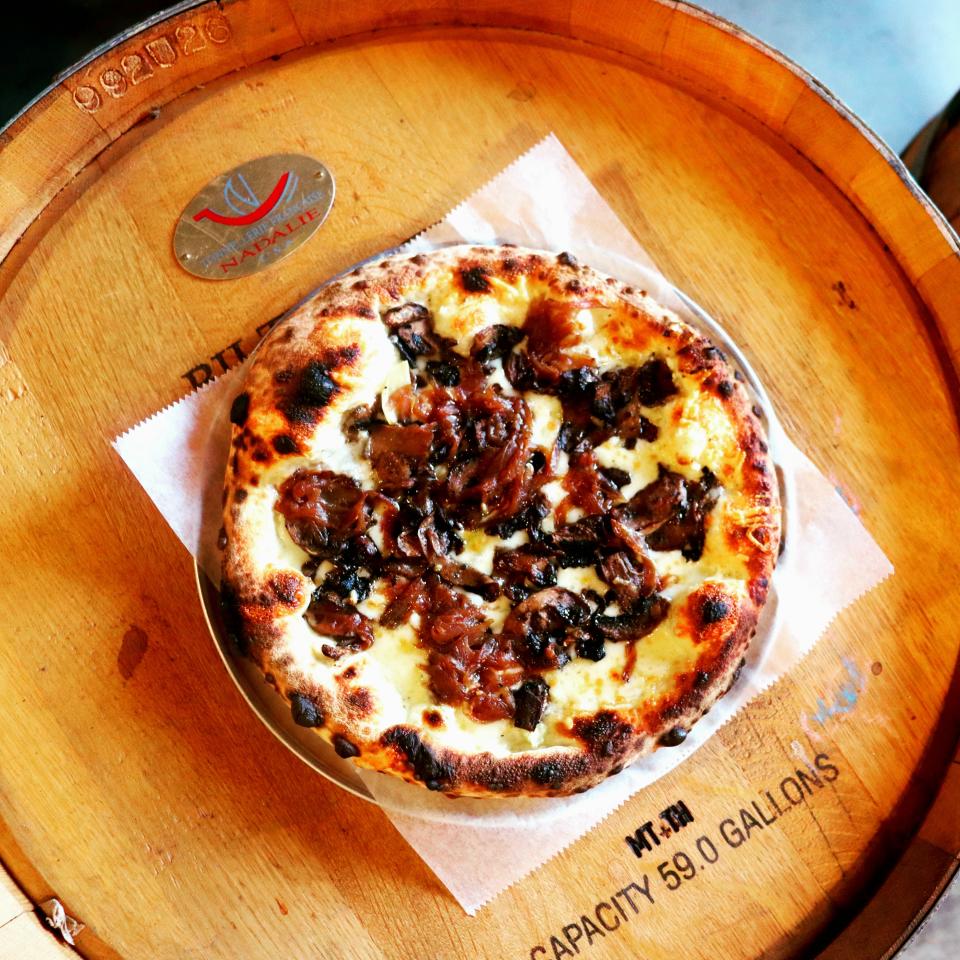 Grata Pizzeria is a West Asheville restaurant that offers artisan pizzas, salads and more.