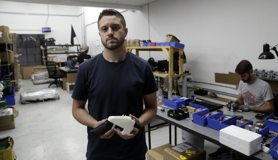 Cody Wilson and his fully 3D-printed gun. (Photo: ASSOCIATED PRESS)