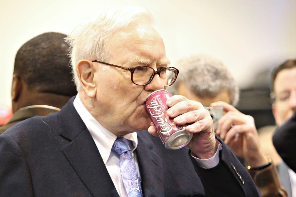 Warren Buffett, chief executive officer of Berkshire Hathaway, drinks a Cherry <a href="https://fortune.com/company/coca-cola/" rel="nofollow noopener" target="_blank" data-ylk="slk:Coca-Cola;elm:context_link;itc:0;sec:content-canvas" class="link rapid-noclick-resp">Coca-Cola</a> as he tours the exhibition floor prior to the Berkshire Hathaway annual meeting in Omaha, Nebraska, U.S., on Saturday, May 1, 2010. Buffett, the Wall Street critic who invested $5 billion in <a href="https://fortune.com/company/goldman-sachs-group/" rel="nofollow noopener" target="_blank" data-ylk="slk:Goldman Sachs;elm:context_link;itc:0;sec:content-canvas" class="link rapid-noclick-resp">Goldman Sachs</a> Group Inc., said he supports the bank's Chief Executive Officer Lloyd Blankfein '100 percent' after the firm was sued by regulators for fraud. Photographer: Daniel Acker/Bloomberg via Getty Images