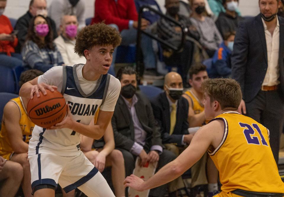 Darius Adams (No. 1) is guarded by St. Rose's Colin Westhoven (No. 21). Manasquan Boys Basketball defeats St Rose in Manasquan NJ on January 18, 2022.