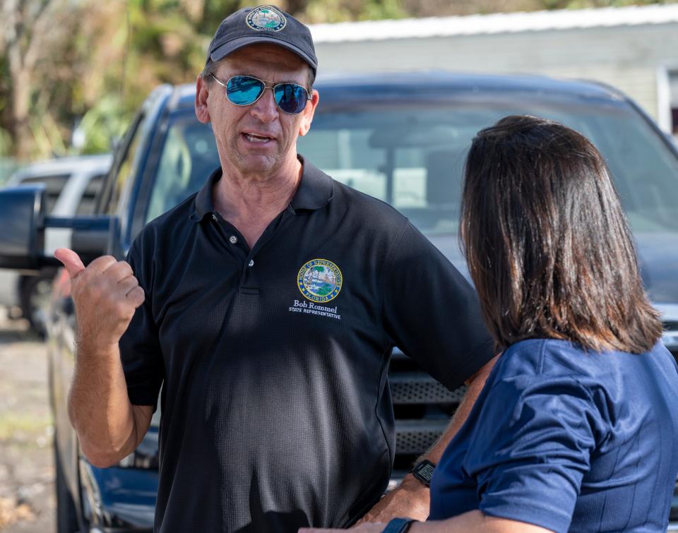 State Rep. Bob Rommel talks with legislative aide Kim Time at the flood-damaged Harmony Shores mobile home park in East Naples, Fla., on Wednesday, Oct. 5, 2022. Rommel visited the park to help residents after being told the property owner issued them an order to u0022vacate immediately.u0022