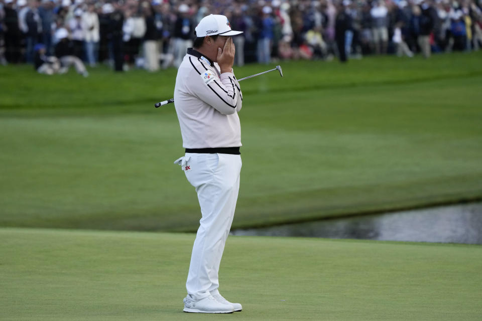 Sungjae Im, of South Korea, reacts after missing a putt for birdie on the 18th hole of the South Course at Torrey Pines during the final round of the Farmers Insurance Open golf tournament, Saturday, Jan. 28, 2023, in San Diego. (AP Photo/Gregory Bull)