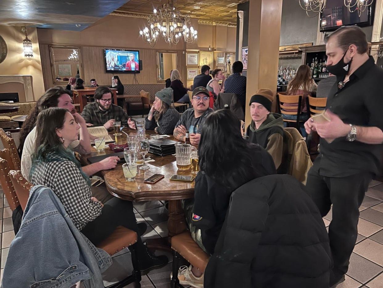 A table full of friends mark the last night of the Sahara Restaurant on Highland Street in Worcester on Friday.