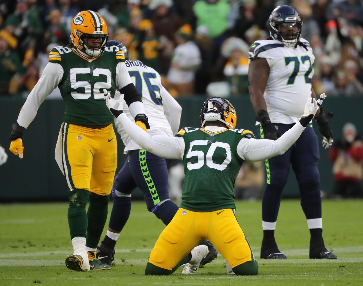 Defensive end Whitney Mercilus (50) celebrates his sack of Seattle Seahawks quarterback Russell Wilson during a game last season. Mercilus, who the Packers acquired mid-season last year, announced his retirement today after 10 years in the NFL.