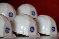 FILE PHOTO - The General Electric logo is pictured on working helmets during a visit at the General Electric offshore wind turbine plant in Montoir-de-Bretagne, near Saint-Nazaire, western France, November 21, 2016. REUTERS/Stephane Mahe/File Photo