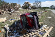 <p>A car destroyed by a tornado is seen in Dunrobin, Ont., west of Ottawa, on Saturday, Sept. 22, 2018.<br>The storm tore roofs off of homes, overturned cars and felled power lines in the Ottawa community of Dunrobin and in Gatineau, Que. (Photo from Justin Tang/The Canadian Press) </p>