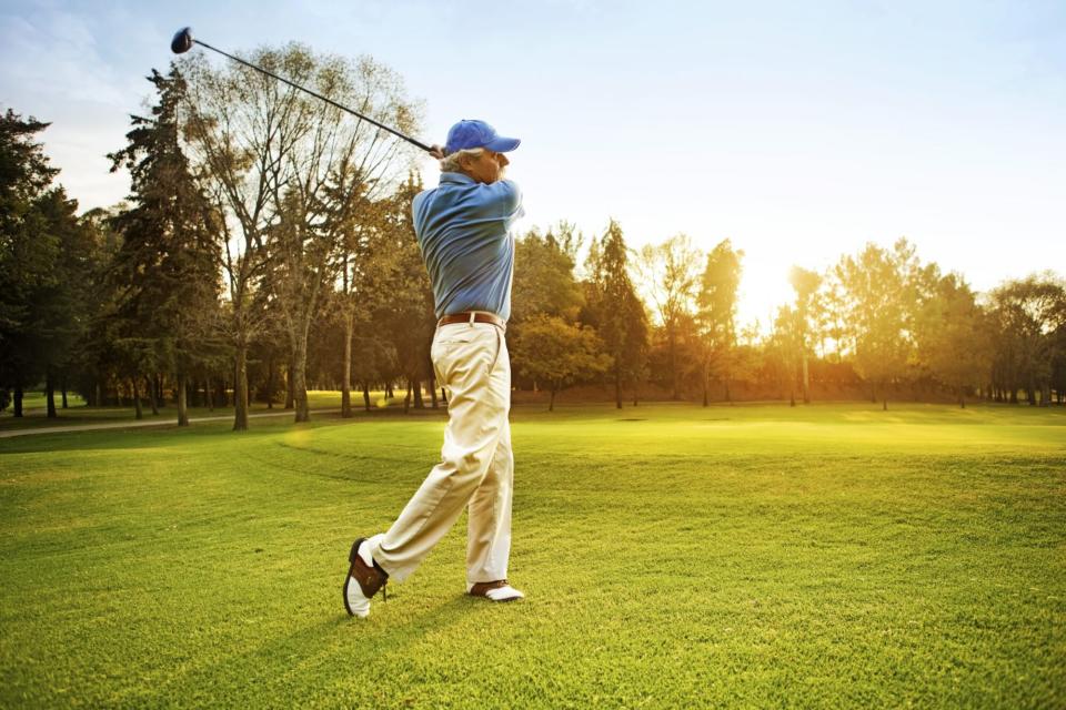 senior man playing golf