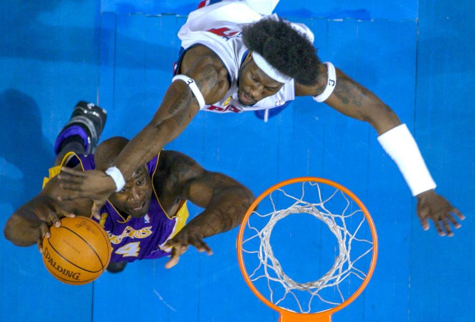 Center Ben Wallace (top) played for the Orlando Magic in Doc Rivers' first season as an NBA head coach.