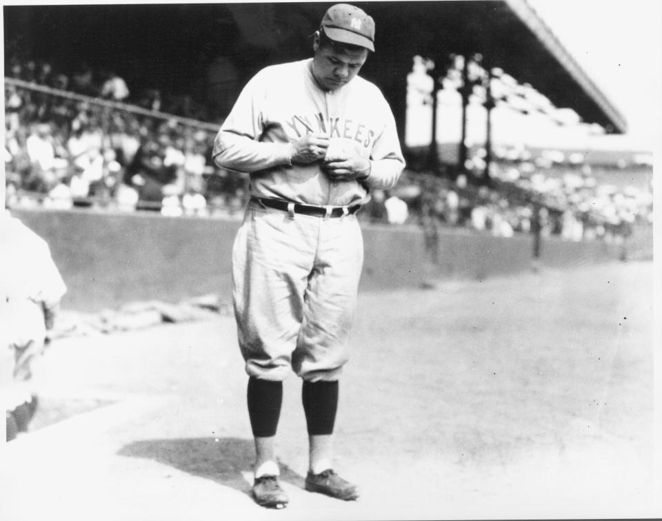 CLEVELAND, OH - 1927: Babe Ruth signing baseball before Indians - Yankees game at League Park. (Photo by Louis Van Oeyen/Western Reserve Historical Society/Getty Images).