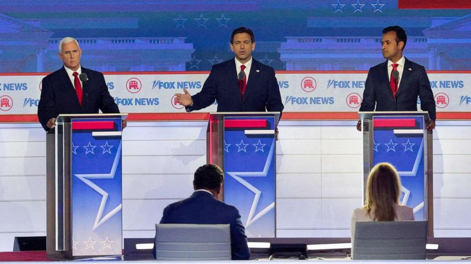 PHOTO: Florida Gov. Ron DeSantis speaks as former Vice President Mike Pence, former biotech executive Vivek Ramaswamy and former South Carolina Gov. Nikki Haley listen at the Republican presidential candidate debate in Milwaukee, Wis., Aug. 23, 2023. (Brian Snyder/Reuters)