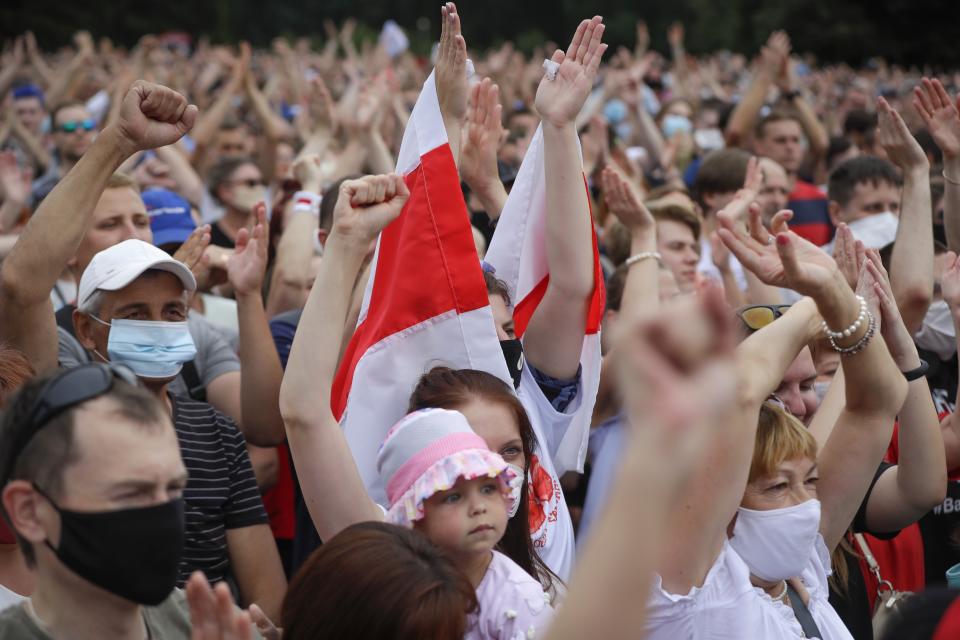 Belarusians attend a meeting in support of Svetlana Tikhanovskaya, candidate for the presidential election, in Minsk, Belarus, Sunday July 19, 2020. The presidential election in Belarus is scheduled for August 9, 2020. (AP Photo/Sergei Grits)
