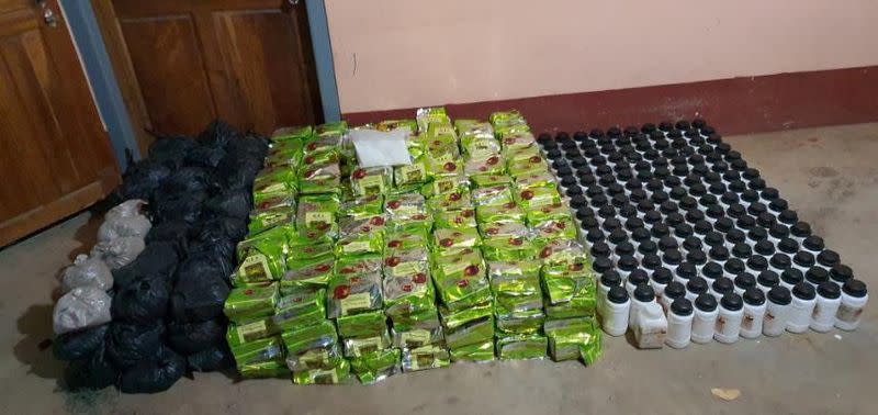 Undated handout photo of distinctive Chinese tea packaging used by the Sam Gor syndicate filled with crystal methamphetamine seized by Myanmar police and military near Loikan village in Shan State