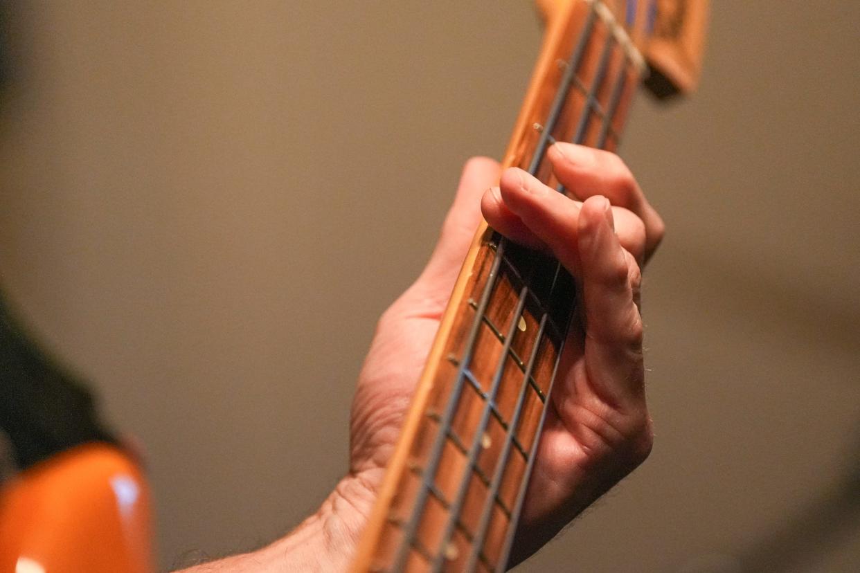 Allan Cole said playing bass has been positive for him socially, but also helps him maintain dexterity in his left hand, which is his weak hand and often becomes rigid.