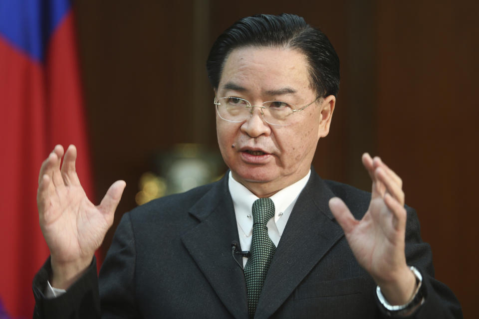 FILE - In this Dec. 10, 2019, file photo, Taiwan's Foreign Minister Joseph Wu speaks during an interview with The Associated Press at the Ministry of Foreign Affairs in Taipei, Taiwan. Wu said Wednesday, April 7, 2021, that China’s attempts at conciliation and military intimidation are sending “mixed signals” to people on the island China claims as its own territory to be won over peacefully or by force. (AP Photo/Chiang Ying-ying, File)