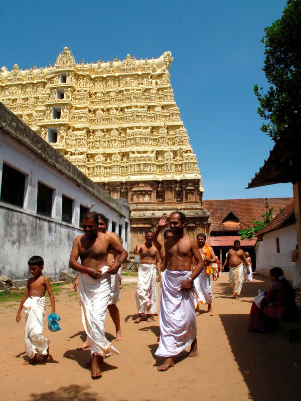 FILE PHOTO: Hindu devotees in white cotton mundus visit the Sree Padmanabhaswamy temple in Kerala state in southern India