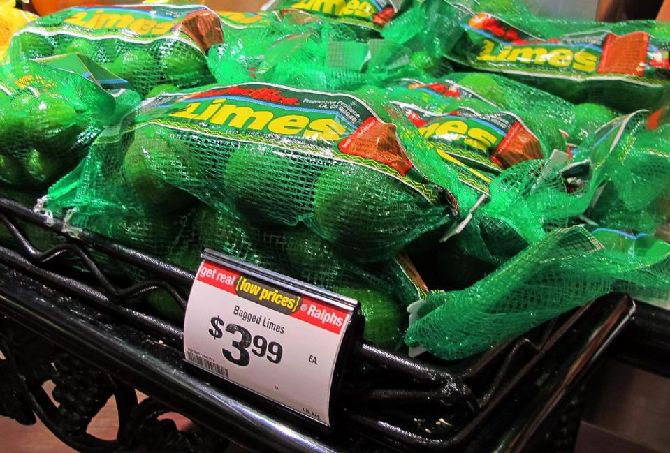 This Saturday, April 26, 2014, photo shows limes on sale for $3.99 for a 1-pound bag at a Ralphs market in Los Angeles. The lime, that humble little fruit that sort of resembles a green golf ball, has skyrocketed in price in recent weeks, quadrupling or, in some areas, going even higher. (AP Photo/Reed Saxon)