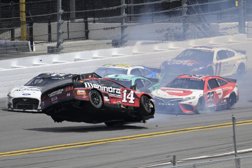 Chase Briscoe (14) lifts and spins in the air along the front stretch after coming out of turn 4 during a NASCAR Cup Series auto race at Daytona International Speedway, Sunday, Aug. 28, 2022, in Daytona Beach, Fla. (AP Photo/Phelan M. Ebenhack)