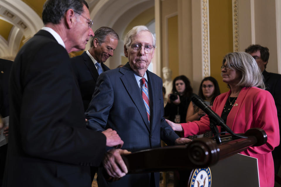 Senators support Sen. Mitch McConnell during a press conference.  (J. Scott Applewhite / AP file)