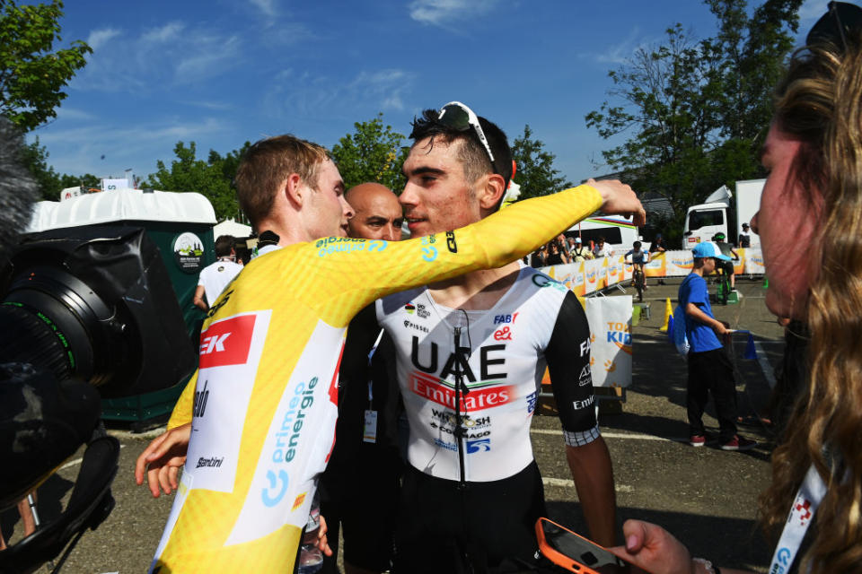 ABTWILL SWITZERLAND  JUNE 18 LR Overall race winner Mattias Skjelmose Jensen of Denmark and Team TrekSegafredo  Yellow Leader Jersey and stage winner Juan Ayuso of Spain and UAE Team Emirates react after the 86th Tour de Suisse 2023 Stage 8 a 257km individual time trial from St Gallen to Abtwil  UCIWT  on June 18 2023 in Abtwil Switzerland Photo by Tim de WaeleGetty Images