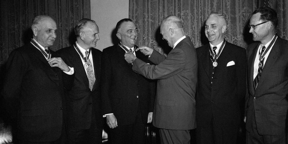 President Dwight Eisenhower and J. Edgar Hoover as the president awards Hoover a medal.