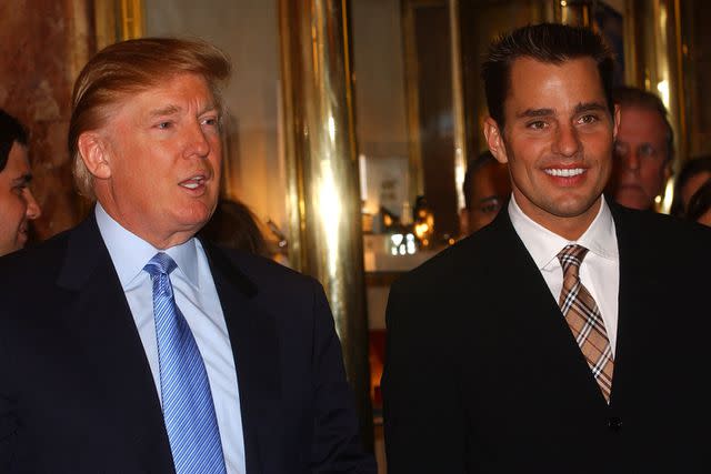 <p>Brad Barket/Getty</p> Donald Trump with 'The Apprentice' season 1 winner, Bill Rancic, at Trump Tower on April 12, 2005