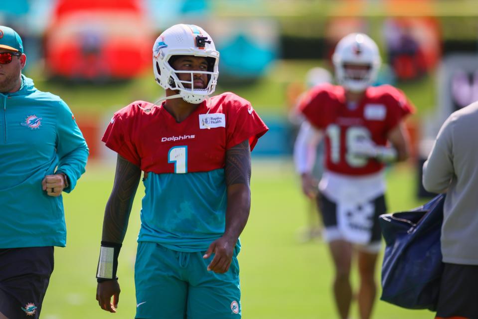 Aug 15, 2024; Miami Gardens, FL, USA; Miami Dolphins quarterback Tua Tagovailoa (1) looks on from the field during joint practice with the Washington Commanders at Baptist Health Training Complex. Mandatory Credit: Sam Navarro-USA TODAY Sports