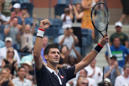 Novak Djokovic of Serbia celebrates after defeating Andreas Seppi of Italy in their third round match at the U.S. Open Championships tennis tournament in New York, September 4, 2015. REUTERS/Adrees Latif