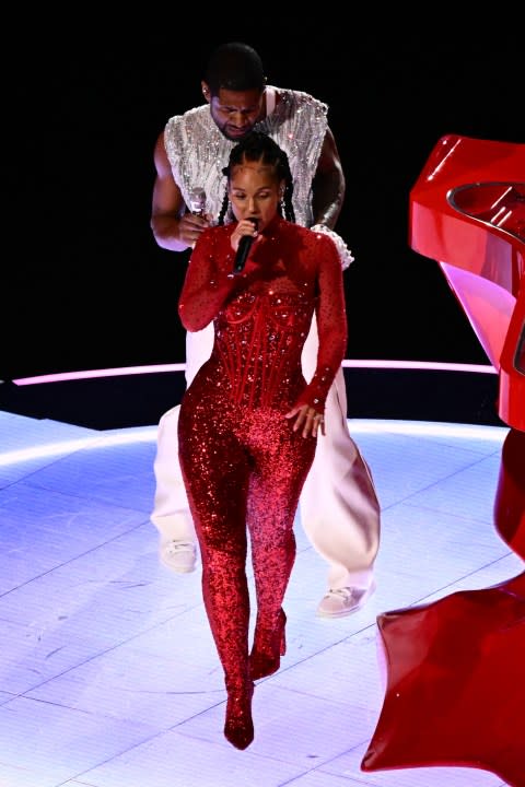 US singer-songwriter Usher (L) and US singer-songwriter Alicia Keys perform during Apple Music halftime show of Super Bowl LVIII between the Kansas City Chiefs and the San Francisco 49ers at Allegiant Stadium in Las Vegas, Nevada, February 11, 2024. (Photo by Patrick T. Fallon / AFP) (Photo by PATRICK T. FALLON/AFP via Getty Images)