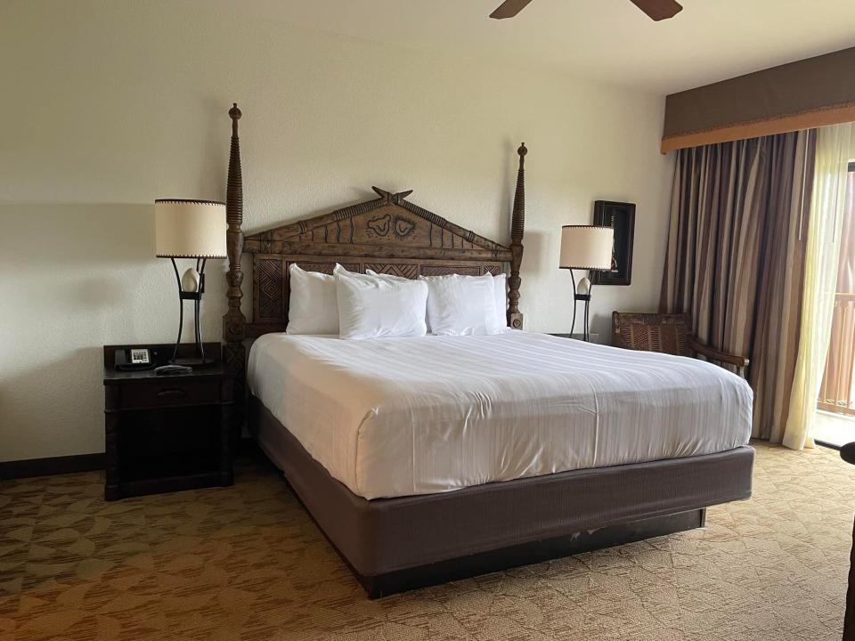 bed in a savanna view suite at animal kingdom lodge