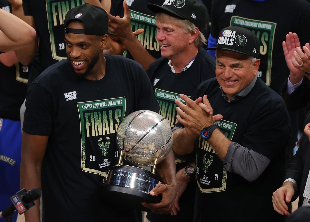 Khris Middleton of the Milwaukee Bucks holds the Eastern Conference Championship trophy after defeating the Atlanta Hawks in Game Six of the Eastern Conference Finals at State Farm Arena on July 03, 2021, in Atlanta, Georgia.