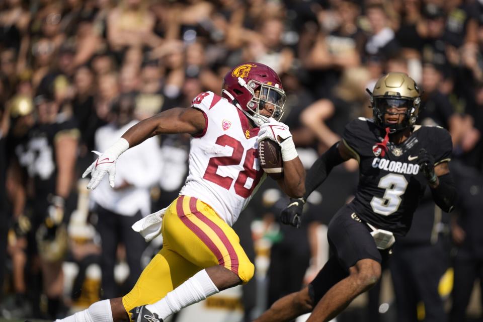 USC's Keaontay Ingram runs on the field.