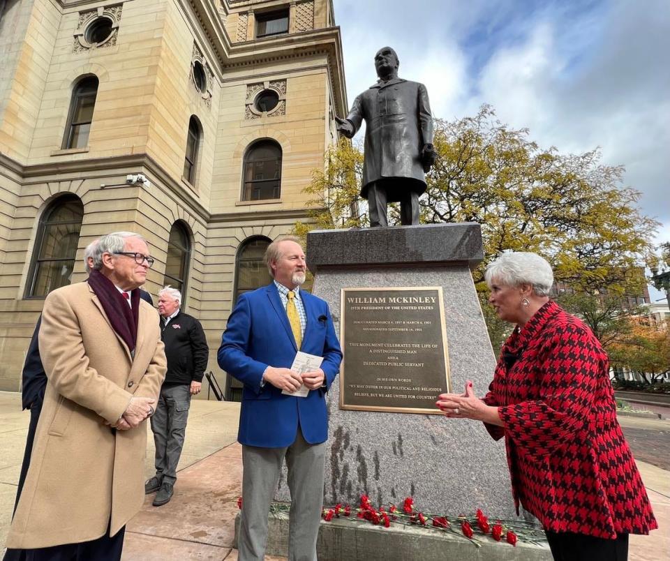 Stark County Commissioner Janet Creighton talks with Gov. Mike DeWine, left, and Robert Timken at October's unveiling of a statue of President William McKinley at the Stark County Courthouse.
