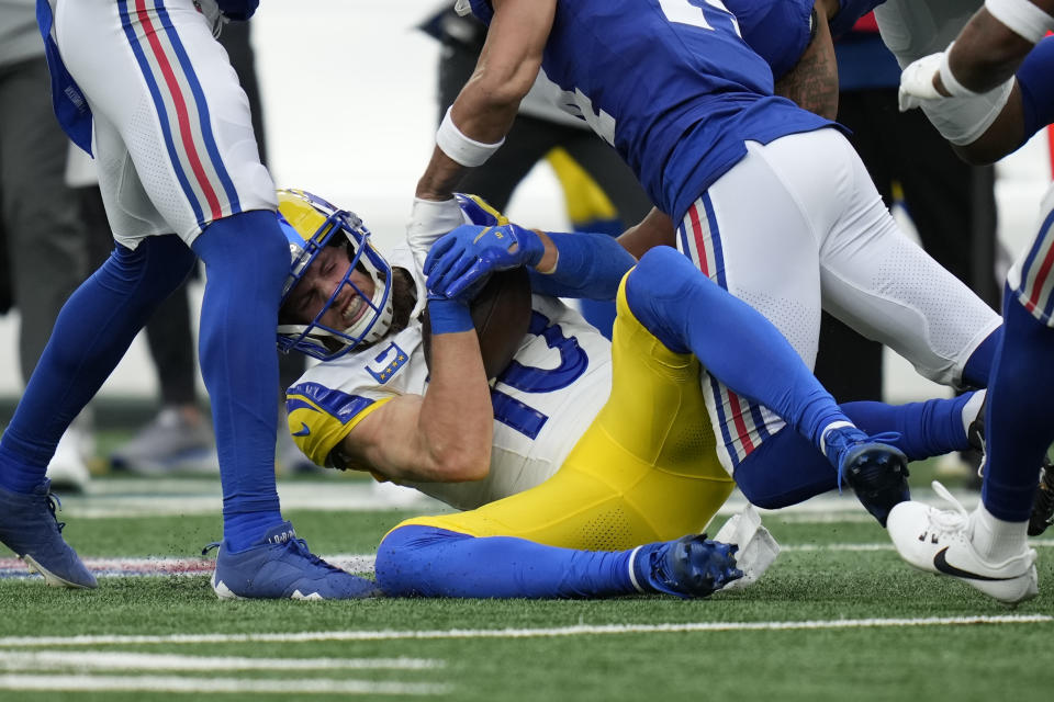 Los Angeles Rams wide receiver Cooper Kupp (10) is tackled during the first half an NFL football game against the New York Giants, Sunday, Dec. 31, 2023, in East Rutherford, N.J. (AP Photo/Seth Wenig)