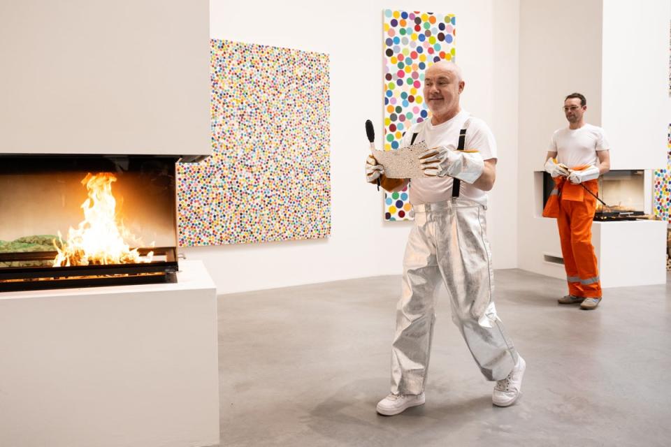 Damien Hirst takes part in the burning of artworks at Newport Street Gallery in October (Getty Images)