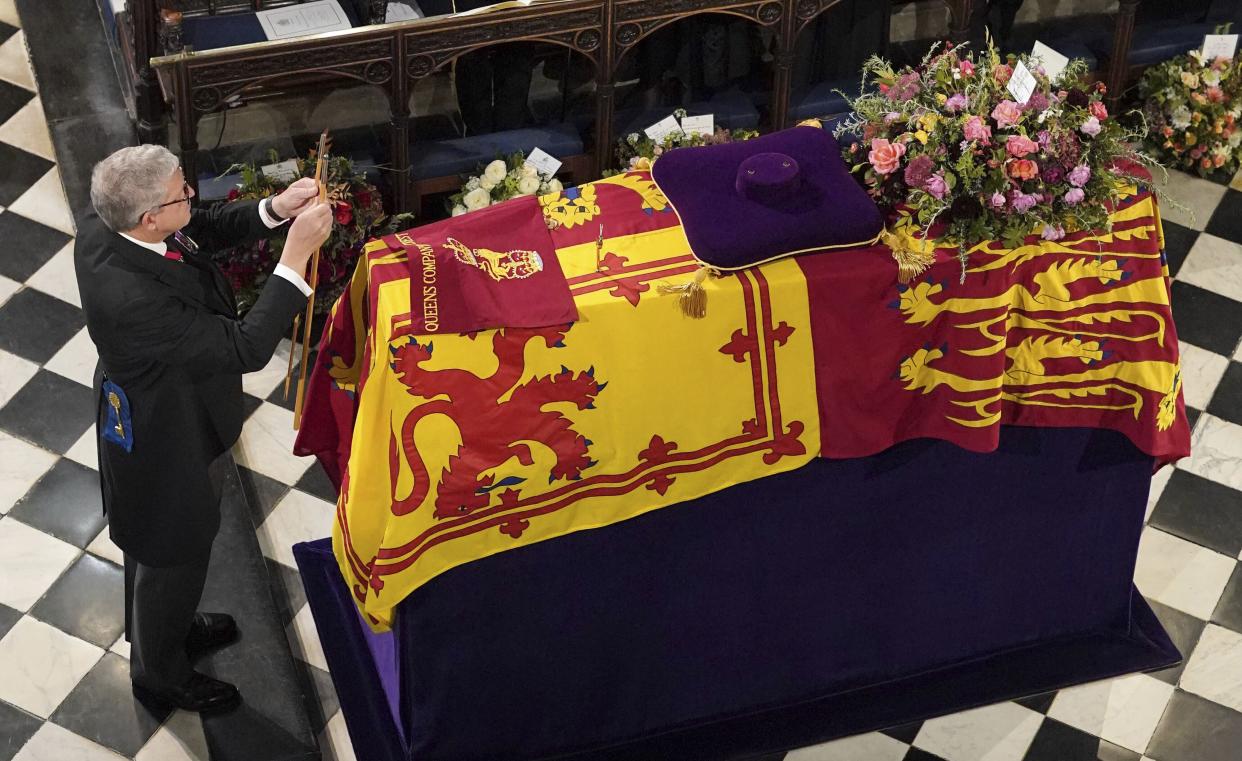 The Lord Chamberlain ceremonially breaks his Wand of Office on the coffin at the Committal Service for Queen Elizabeth II, held at St George's Chapel in Windsor Castle, Monday Sept. 19, 2022. 