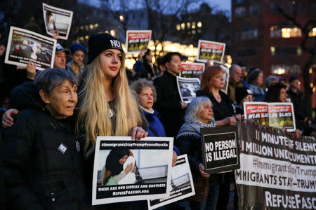 FILE PHOTO: Activists and Deferred Action for Childhood Arrivals (DACA) recipients protest against the Trump administration's policies on immigrants and immigration, during a demonstration in Manhattan, New York, U.S., March 1, 2018. REUTERS/Amr Alfiky/File Photo