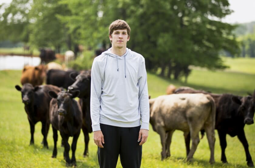 Newark, AR - May 11: Lakers rookie guard Austin Reaves, nicknamed "Hillbilly Kobe" in college, in his hometown on Wednesday, May 11, 2022 in Newark, AR.(Steven Jones / Los Angeles Times) Reaves at the family cattle farm in Newark.