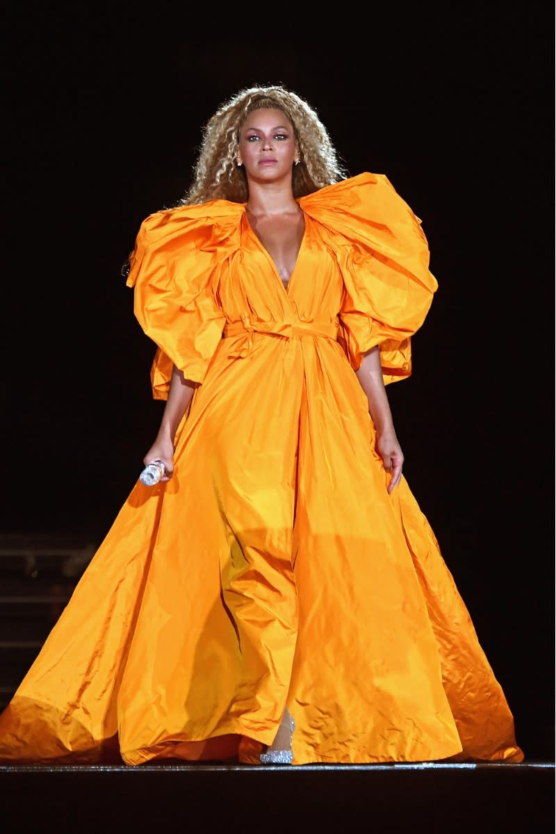 Beyoncé wears a yellow gown as she performs onstage during the 