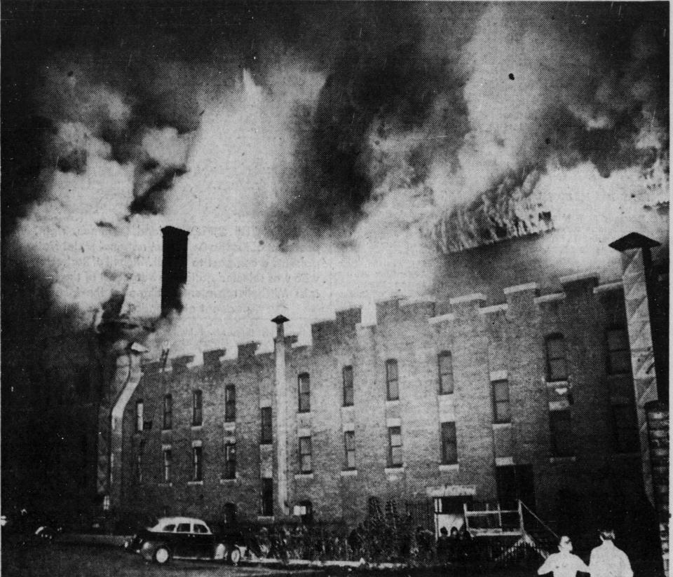 Flames consume the roof structure of the former Binghamton armory in September 1951.