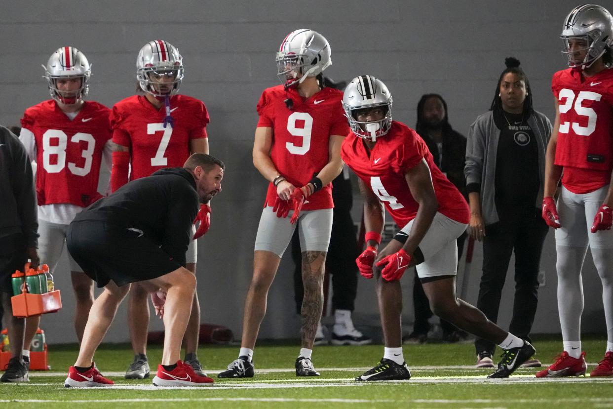 Mar 5, 2024; Columbus, OH, USA; Ohio State Buckeyes offensive coordinator Brian Hartline lines up beside wide receiver Jeremiah Smith (4) during the first spring practice at the Woody Hayes Athletic Center.